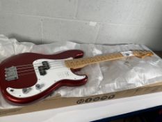 A boxed as new Fender Standard Series Precision Bass, Candy Cola (SN: ICF25019384).