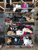 A large quantity of assorted pre-owned clothing in four baskets.