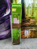 An as new Greenworks 24v pole saw/hedge trimmer (Damage to box).