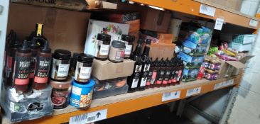 A shelf of assorted in date food, drinks and related.