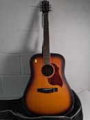 A pre-owned Donner DAG-15 six string acoustic guitar with travel case.