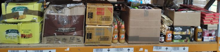 A shelf of assorted out-of-date food, drinks and related.
