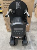 An SKMA F-90 Automatic sealing Machine, black (some minor damage, sold as seen).