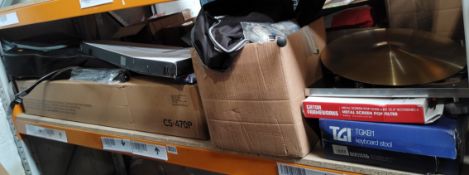 A shelf of audio and musical related products.