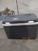 A pre-owned Alpicool MG9 mini portable fridge.