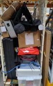 A quantity of assorted lost property items to include camping items, card games and related (cage no