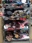 A quantity of assorted pre-owned clothing (four shelf baskets not included).