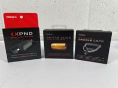 A D'Addario Self-Centering Capo, an XPND Pedal Noise Isolator and a Rich Robinson Signature Guitar S