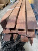 Twelve hardwood foundation posts, 150 x 6 x 6cm approximately.