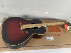 An as new Gretsch Jim Dandy Concert Acoustic Guitar in Deep Cherry Burst.