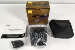 An as new Nikon Travelite EX binoculars 8 X 25CF, with instructions and strap, boxed. (BAA704AA)