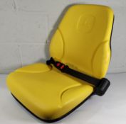 An as new John Deere tractor seat assmebly with seatbelt.