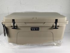 An as new Yeti 65 Cool Box in Desert Tan (REF: 888830063477).