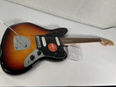 An as new Squier Affinity Series Jaguar, Indian Laurel fingerboard, black pickguard, 3-colour sunbur