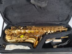 A pre-owned Alto saxophone in travel case.