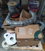 An assortment of mixed cables and reels.