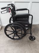 A Made self propel wheelchair in black (requires footrests, small tear to arm rest).
