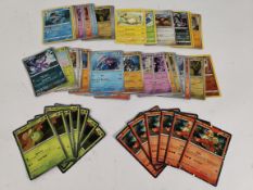 Fifty-Eight Pokemon TCG trading cards to include reverse/regular foil rares and promo cards.