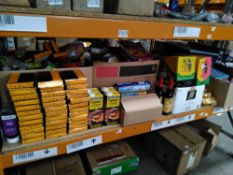 A shelf of assorted in date food, drinks and related.