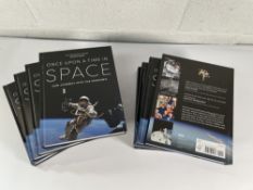 Eight copies of 'Once Upon A Time In Space' by James Bluemel (Hardcover).
