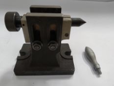Preowned metal lathe tailstock with one additional attachment. L 150mm, W 100mm, H 150mm.