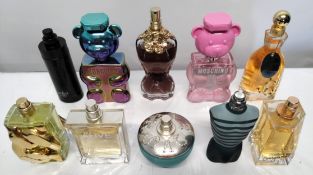 Thirty perfumes/testers and related to include Moschino, Estee Lauder, Versace, Ralph Lauren and mor