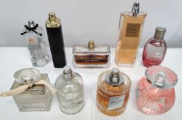 Thirty perfumes/testers and related to include Estee Lauder, Boss, Gucci, Burberry and more! (please