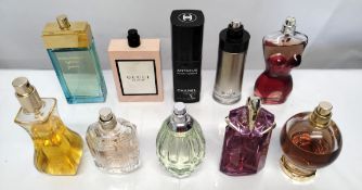 Thirty perfumes/testers and related to include Chanel, Jean Paul Gaultier, Carolina Herrera, Armani