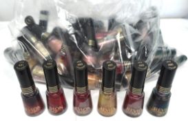 Approximately forty Revlon nail varnishes, various colour shades.