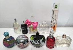 Fifty perfumes/testers and related to include DKNY, Calvin Klein, Marc Jacobs, Juicy Couture and mor
