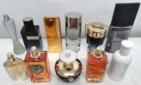 Thirty perfumes/testers and related to include Prada, Boss, Armani, Ralph Lauren and more! (please n