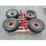 Four preowned Wheels 14.5" with 4x Amazon Basics Steel Jack Auto 3 Ton.