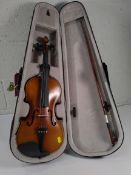 A pre-owned Raxtone RT01-P violin with case and bow.