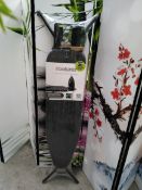 An as new Brabantia ironing board A, 110x30cm, steam iron rest.