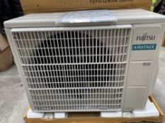 A Fujitsu Airstage Outdoor Unit AOEH09KLTA (has some minor damage to one of the mounting brackets).
