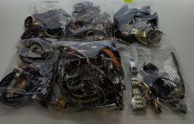 A quantity of assorted preowned costume jewelry and twenty five assorted preowned wrist watches.
