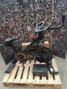 A preowned Peloton Cross training bike (Requires power cable) and a pair of Pelton clip on shoes (si