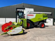 2013 Claas Lexion 740 combine harvester with Claas Vario 9m header and trailer with twin side knives