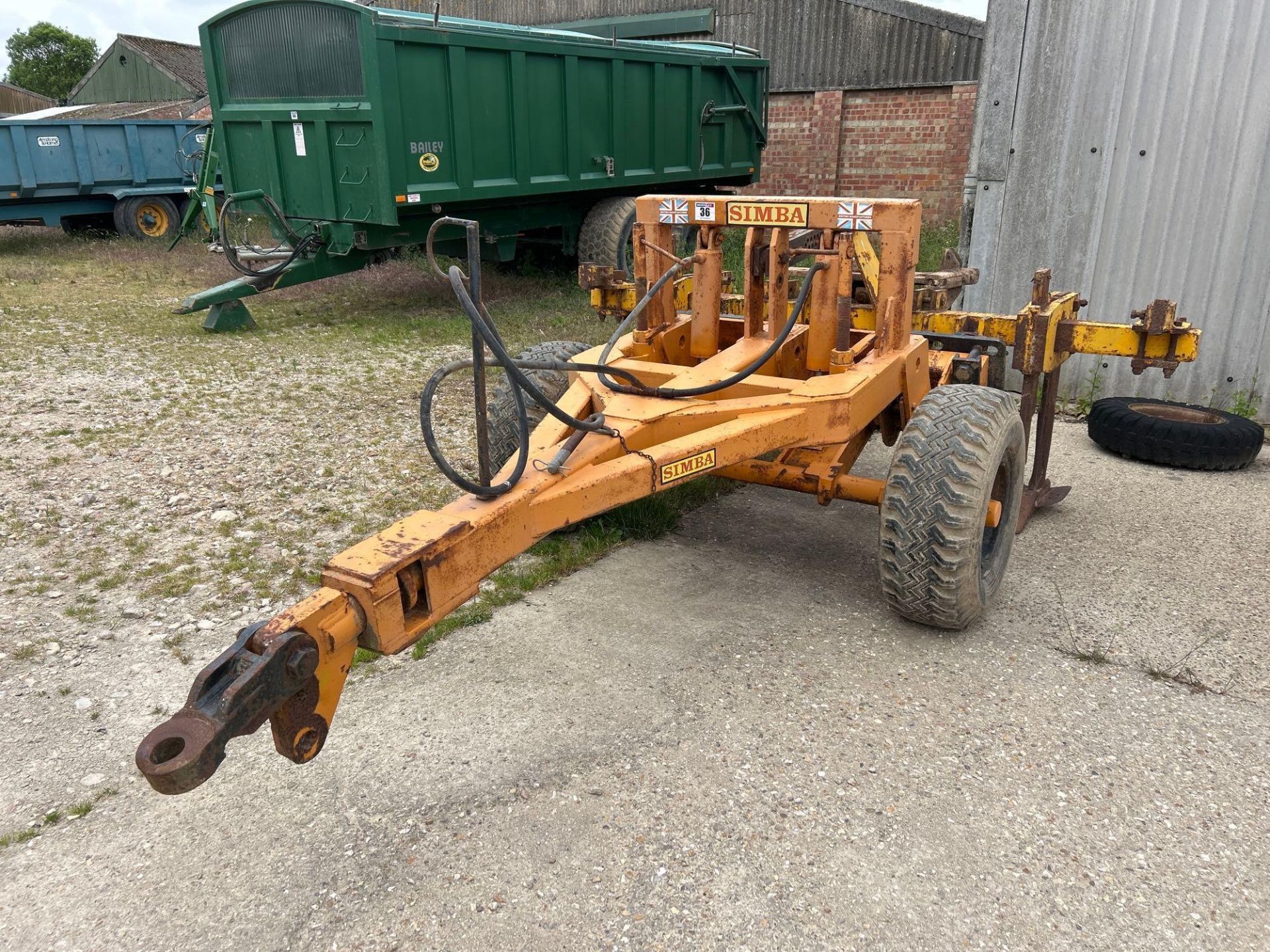 Simba trailed toolbar with twin leg subsoiler, hydraulic operated.