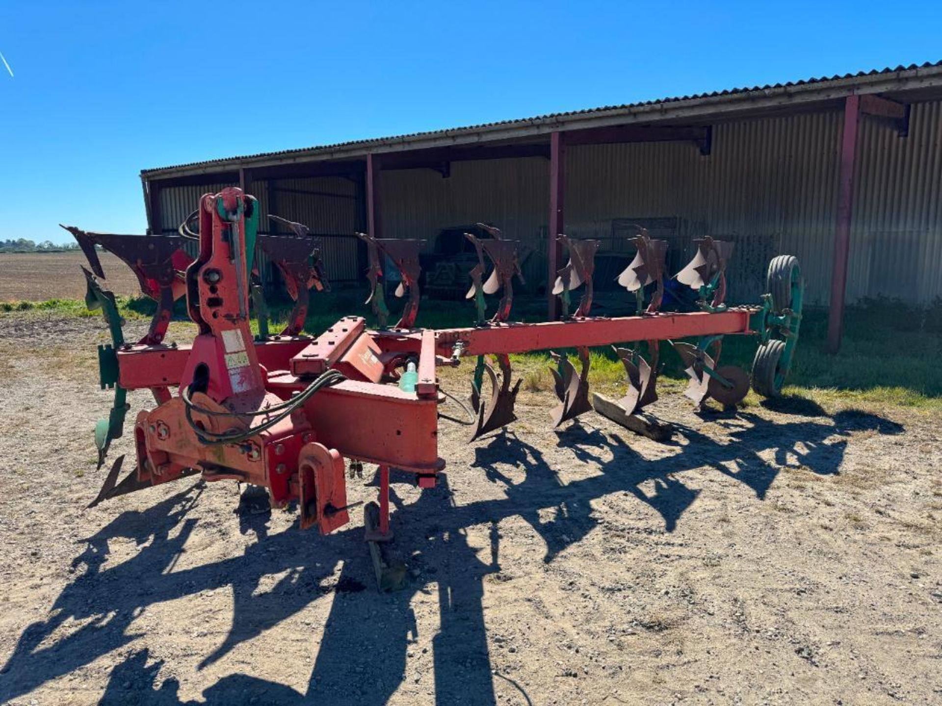 Kverneland LO85/300/28 7 furrow on-land reversible plough with skimmers and subsoiler points. Serial