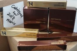 2 x 105g tubs of Hourglass veil translucent powder, 2 x 6ml applicators of Hourglass concealer,