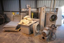 Components of a large dust extraction unit, with stand and large fan and motor.