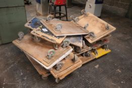Large quantity of workshop wheeled dollies.