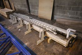 Machine bed with various pneumatic actuators.