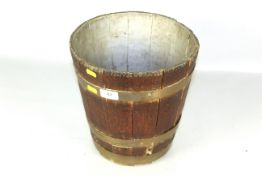 A wooden slatted and brass coopered planter AF
