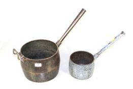 Two cast iron saucepans; one a Falkirk No.10 seven quart saucepan and the other an enamelled cast