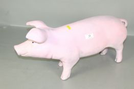 A large butchers advertising display pig