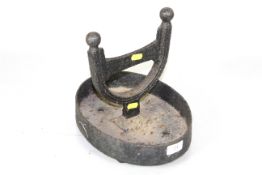 A cast iron boot scraper