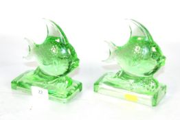 A pair of 1930s green pressed glass fish ornaments