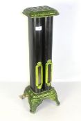 An ornate cast iron and green enamelled gas fire